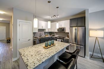 A Kitchen With a Countertop at The Aster Apartments, Cary, North Carolina
